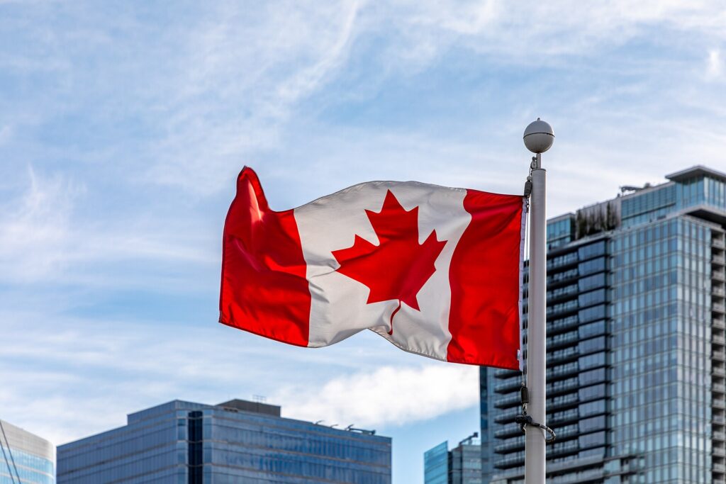 Vladyslav Vlasyuk; Canada flag; Ottawa parliament building Vladyslav Vlasyuk; Canada flag; Ottawa parliament building
