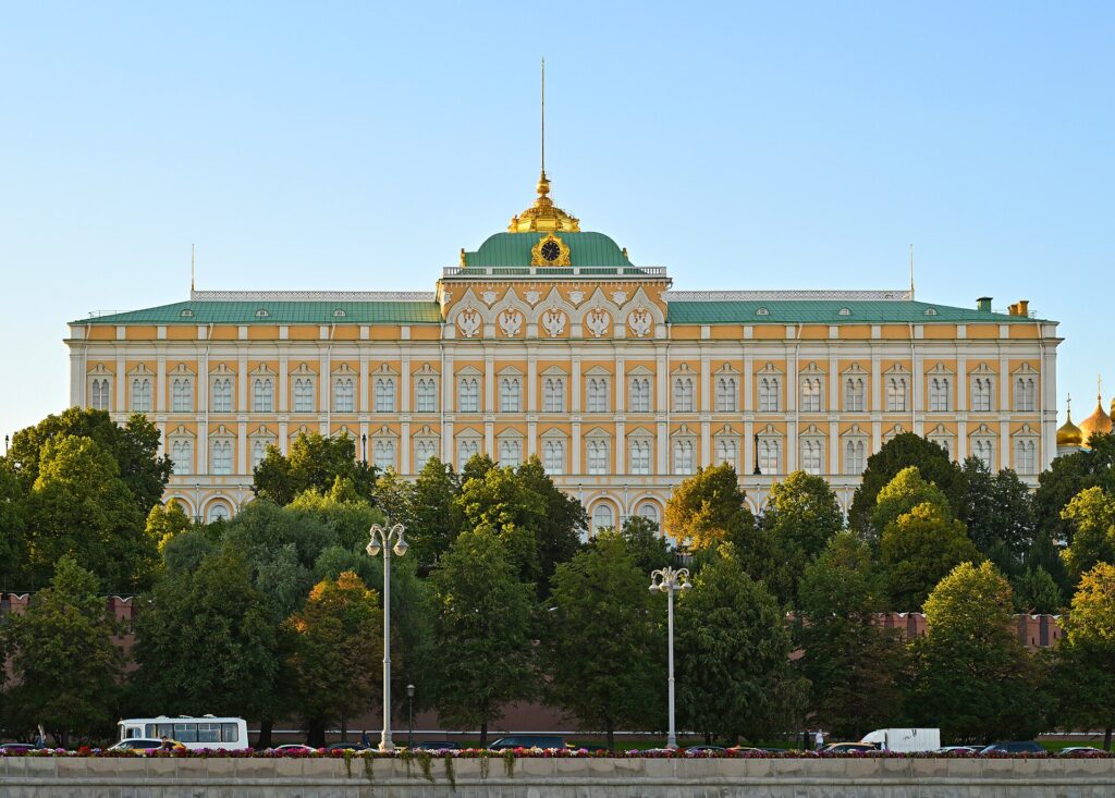 Kremlin building; Russian flag; war room map