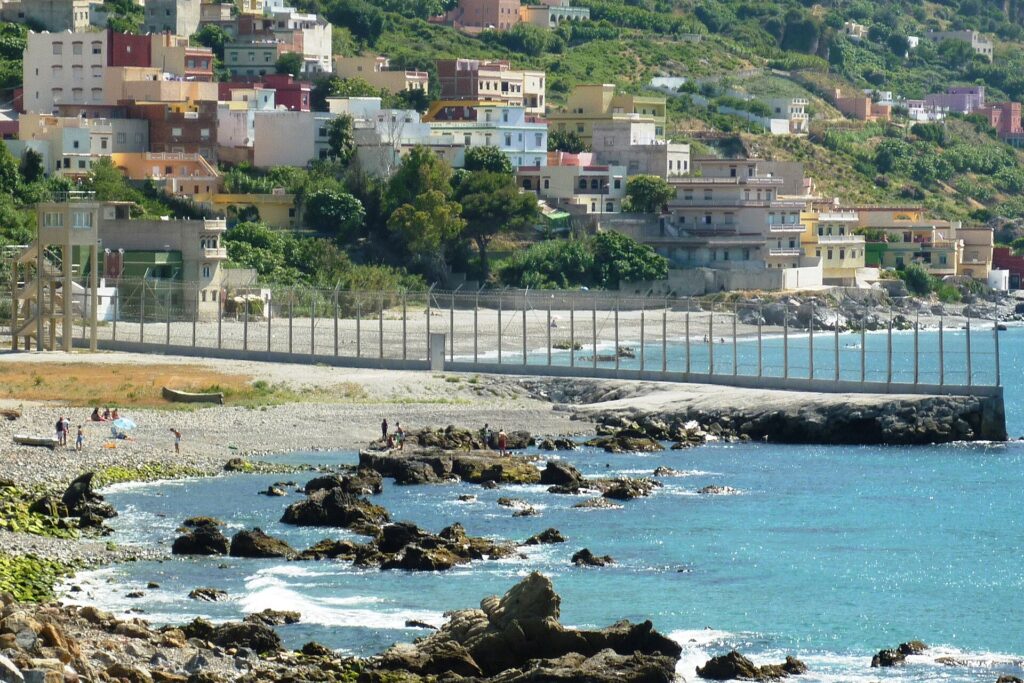 Ceuta border fence; Morocco police; African migrants