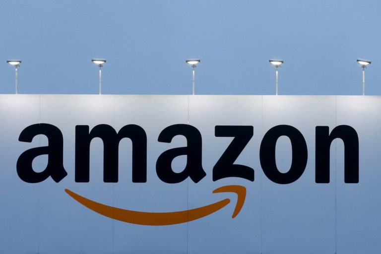 FILE PHOTO:   The logo of Amazon is seen at the company logistics center in Lauwin-Planque, northern France on February 20, 2017.  REUTERS/Pascal Rossignol/File Photo