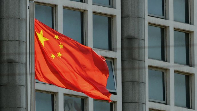 The Chinese national flag is seen on a flagpole in Beijing on August 8, 2016. - Most of the five stars on the Chinese flags being used at medal ceremonies at the Rio Olympics are misaligned, officials said, prompting a diplomatic protest and online fury. (Photo by AFP) (Photo by STR/AFP via Getty Images)